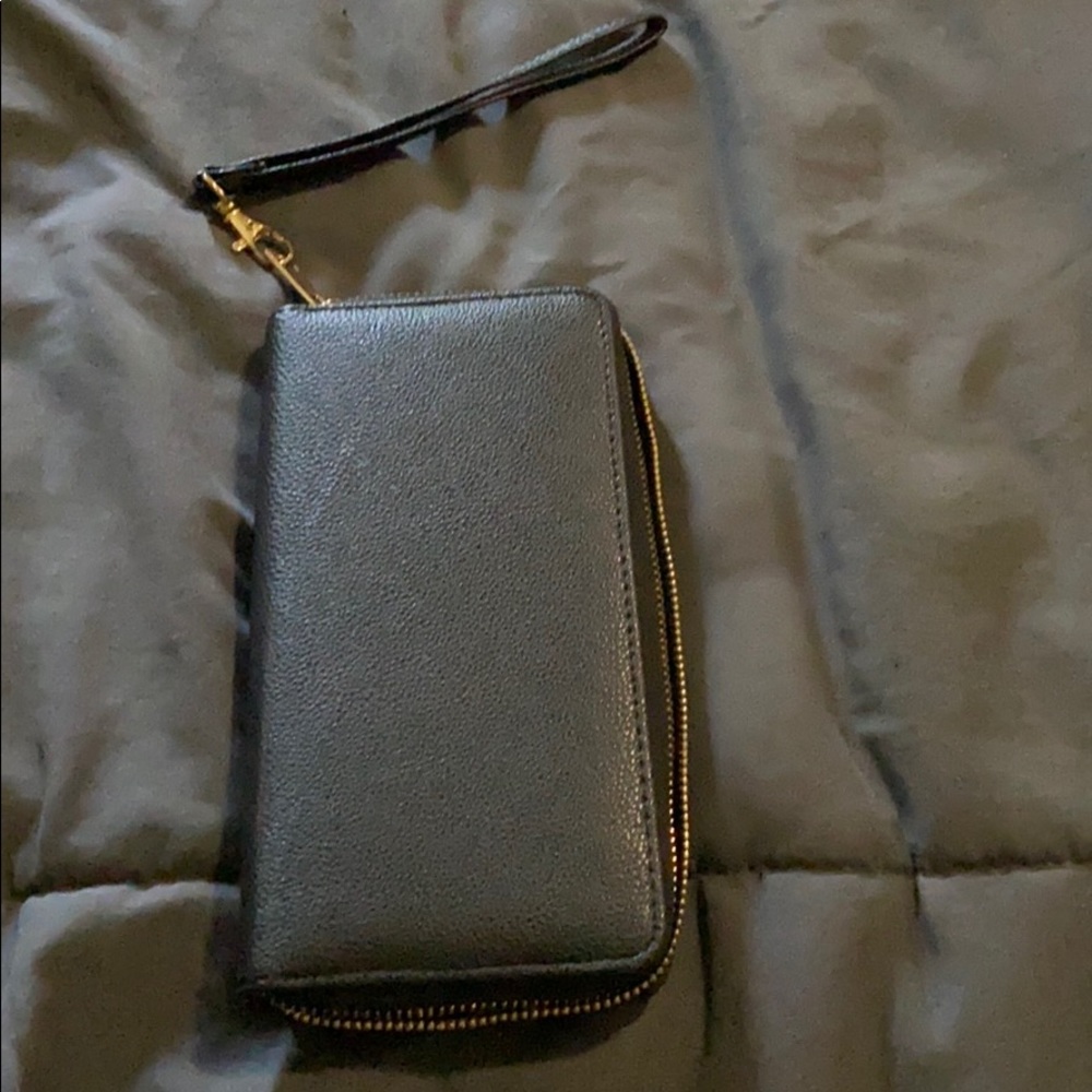 Large wristlet wallet with cell phone pocket